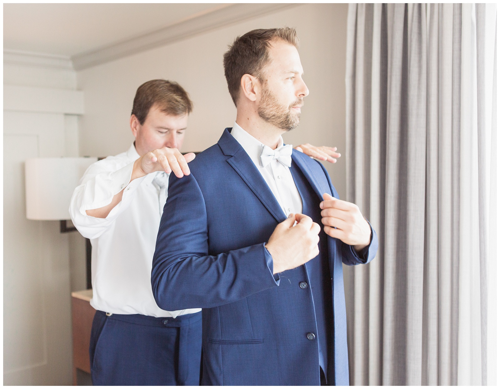 Best man helping groom get ready | Matlock and Kelly Photography