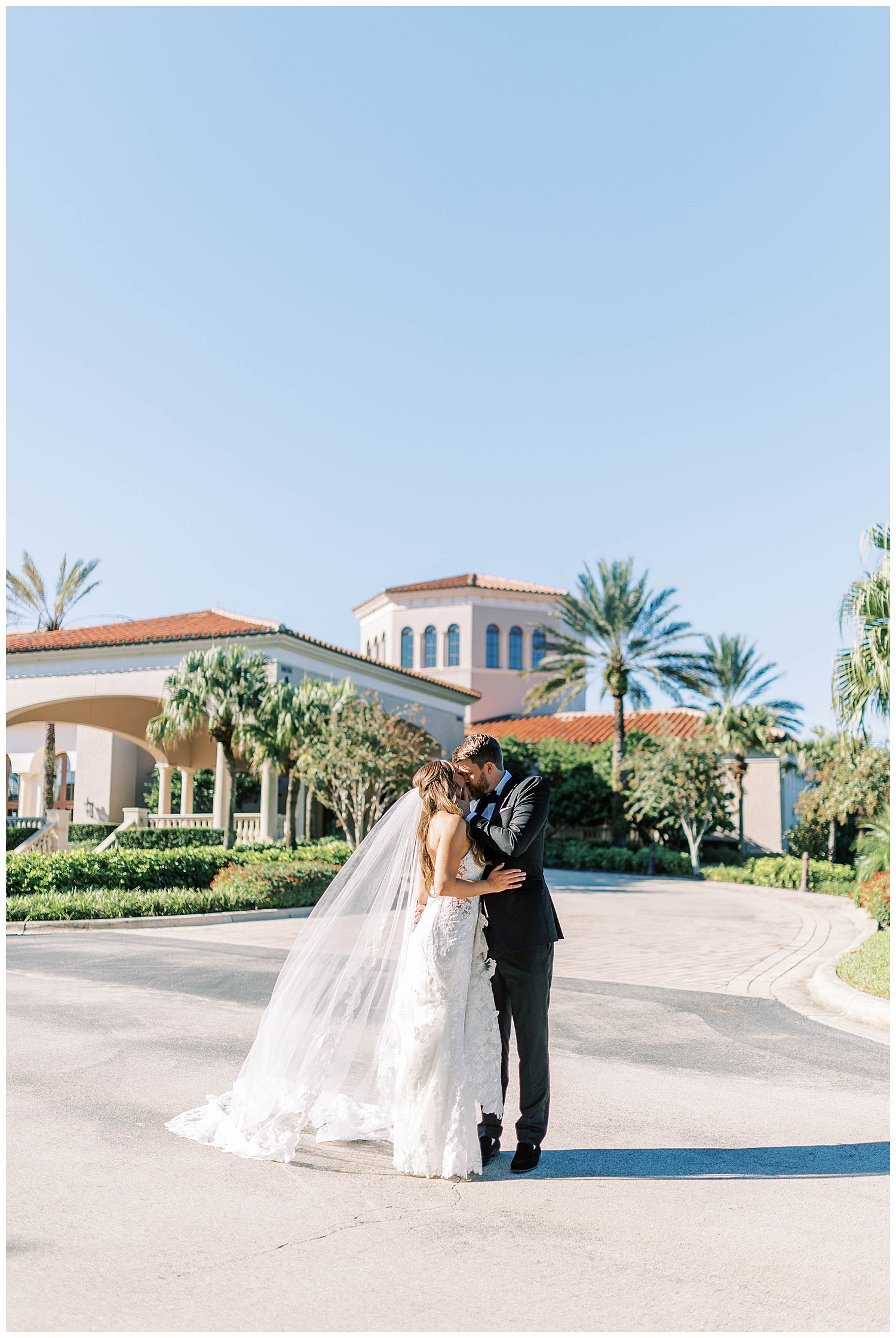 Bride and groom in front of the Country Club of Orlando during their wedding
