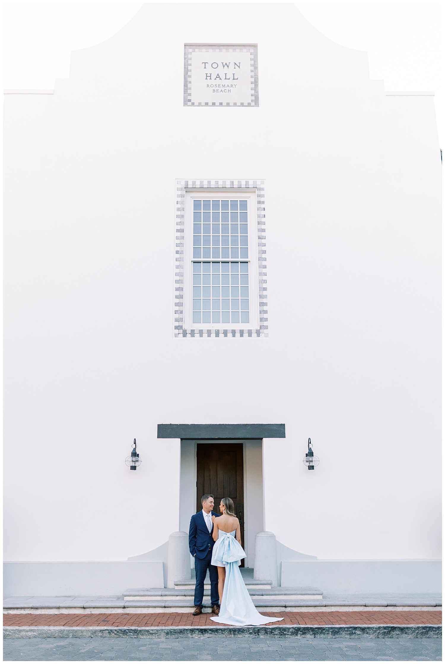 Engagement session photo in front of town hall at Rosemary Beach, Florida