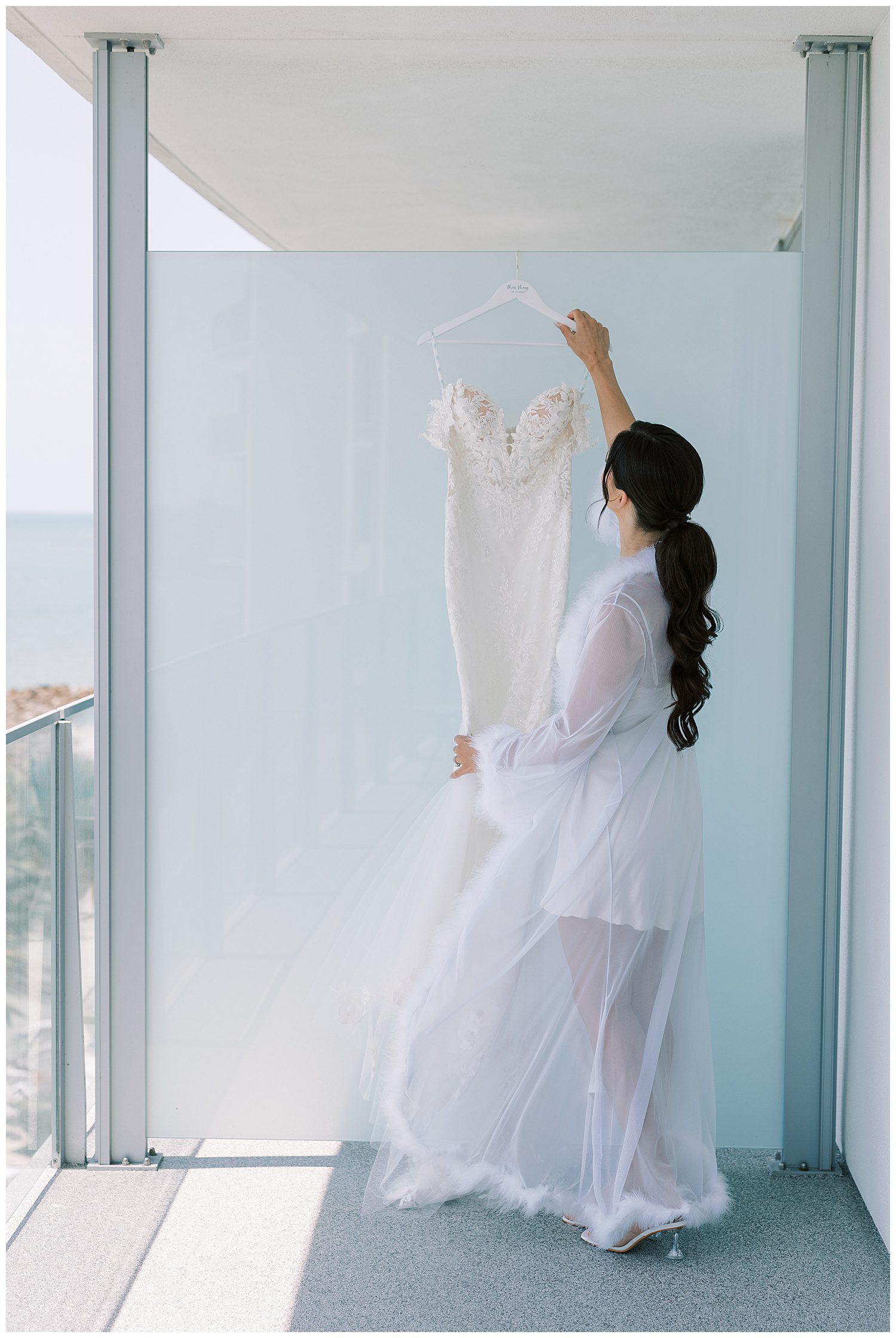 Bride looking at her wedding dress at Opal Sands Resort