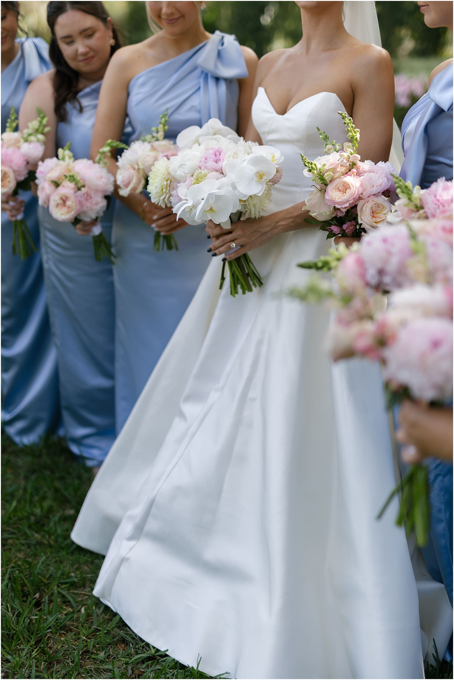 Spring wedding floral with blue bridesmaid dresses