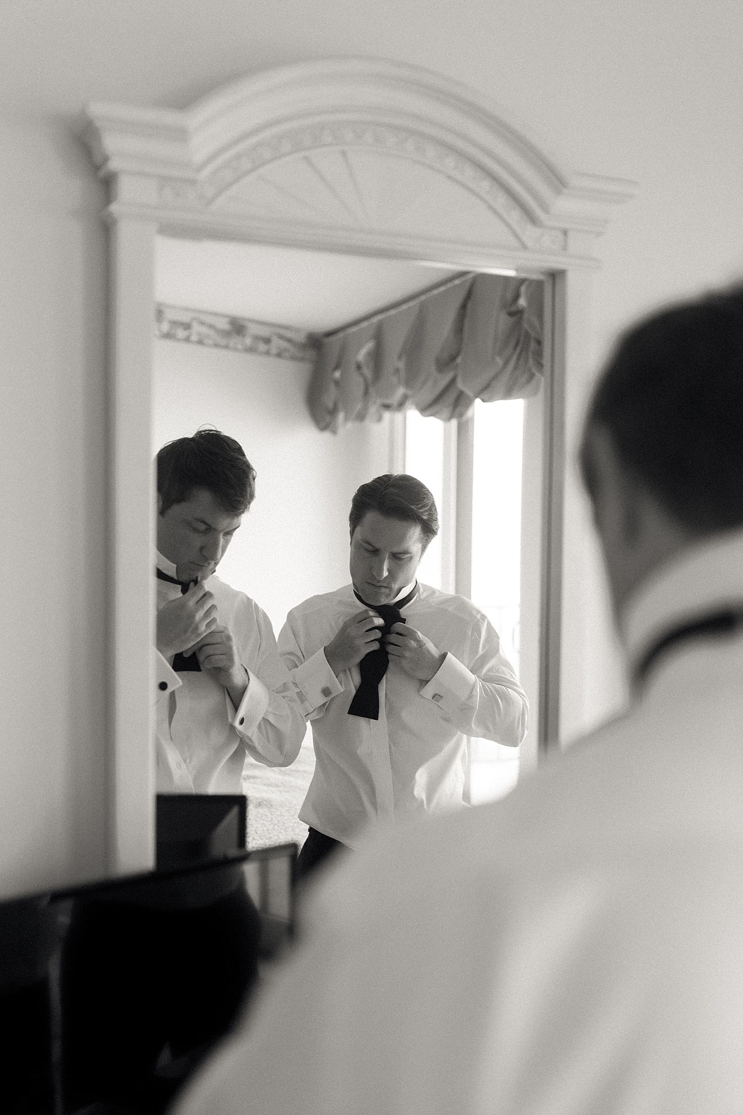 Groom and his best man getting ready for his Amelia Island wedding