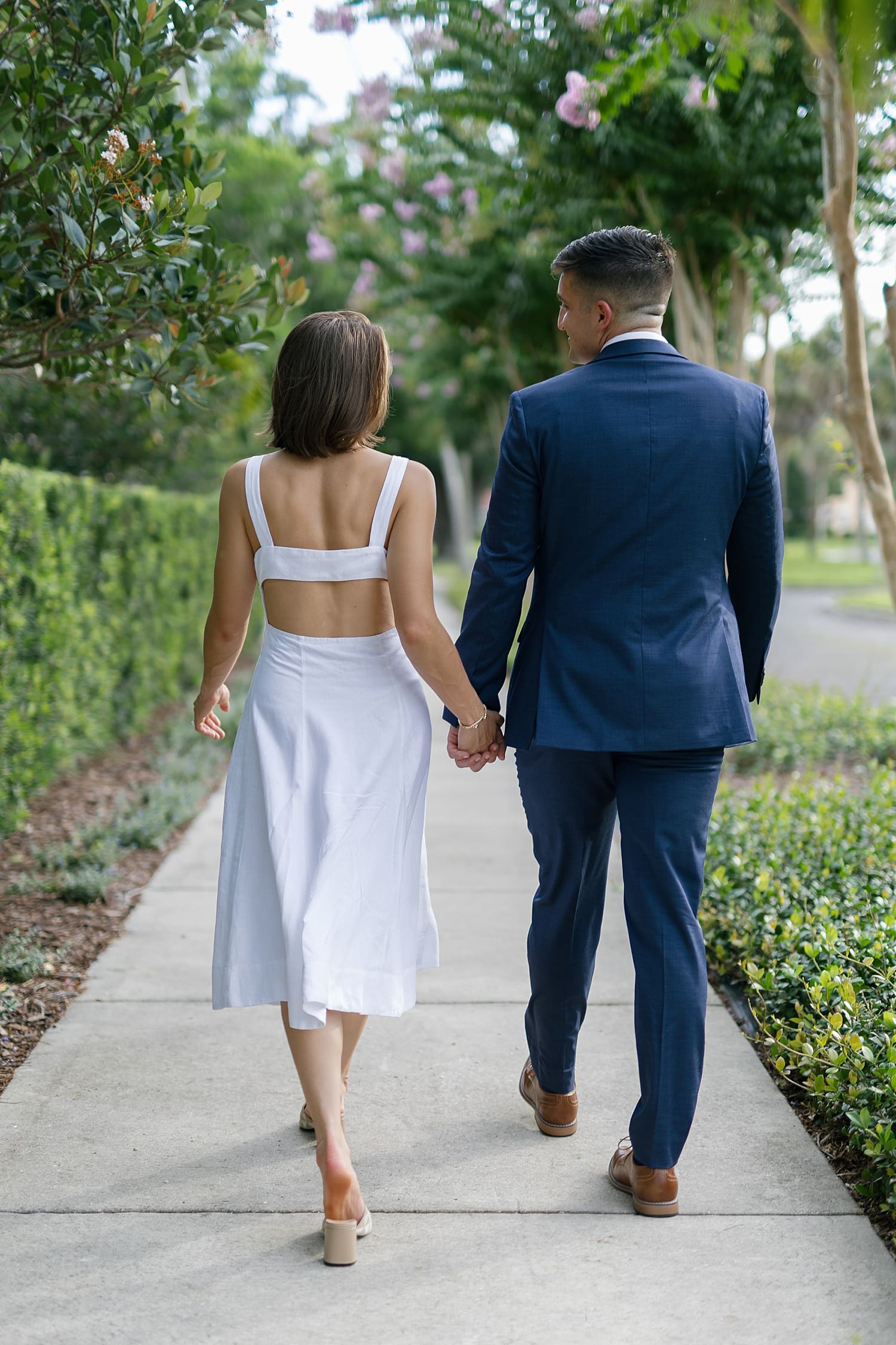 Couple walking during engagement session in St. Petersburg FL