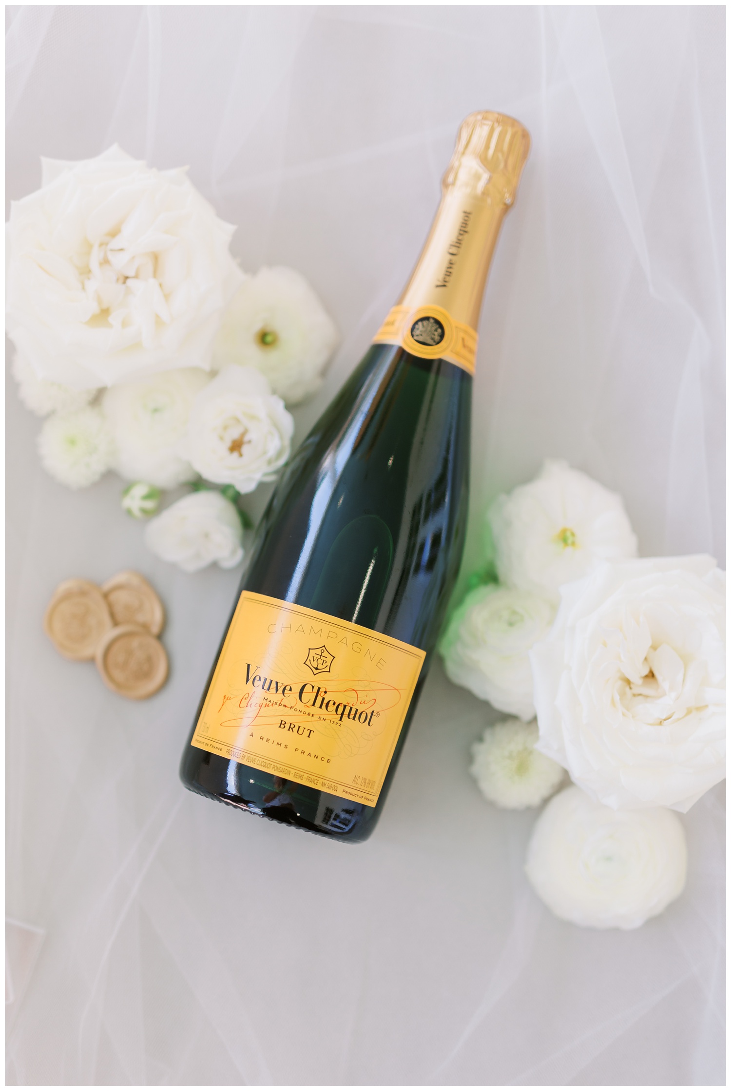 Champagne wedding flat lay with flowers