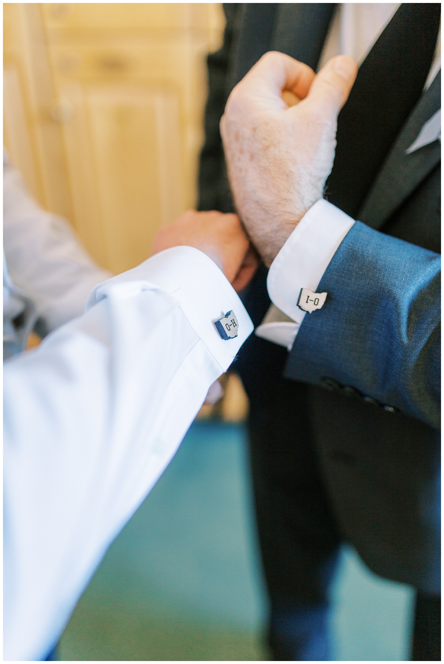 Groom and father with matching cuff links