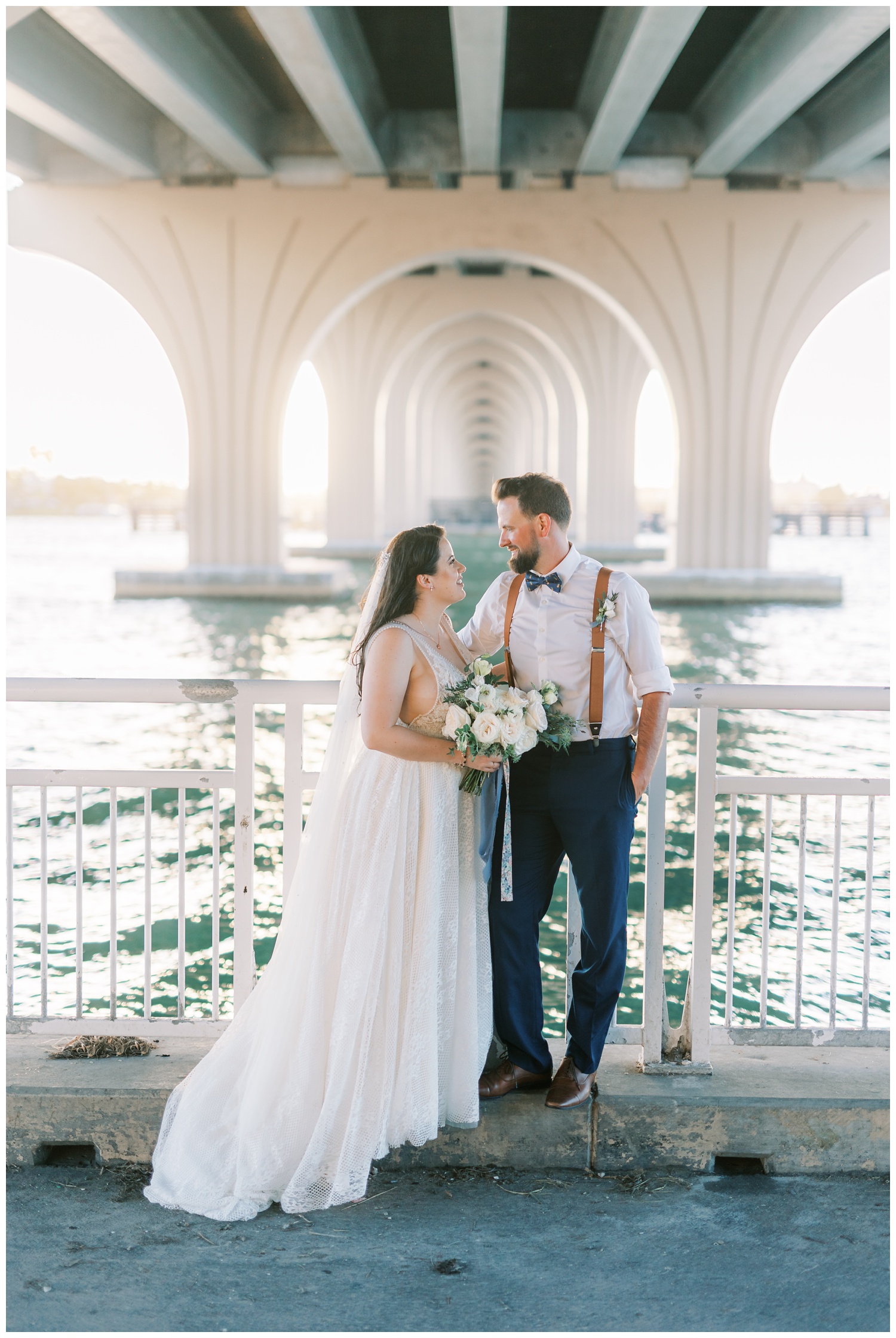 Bride and groom under bridge at Isla Del Sol