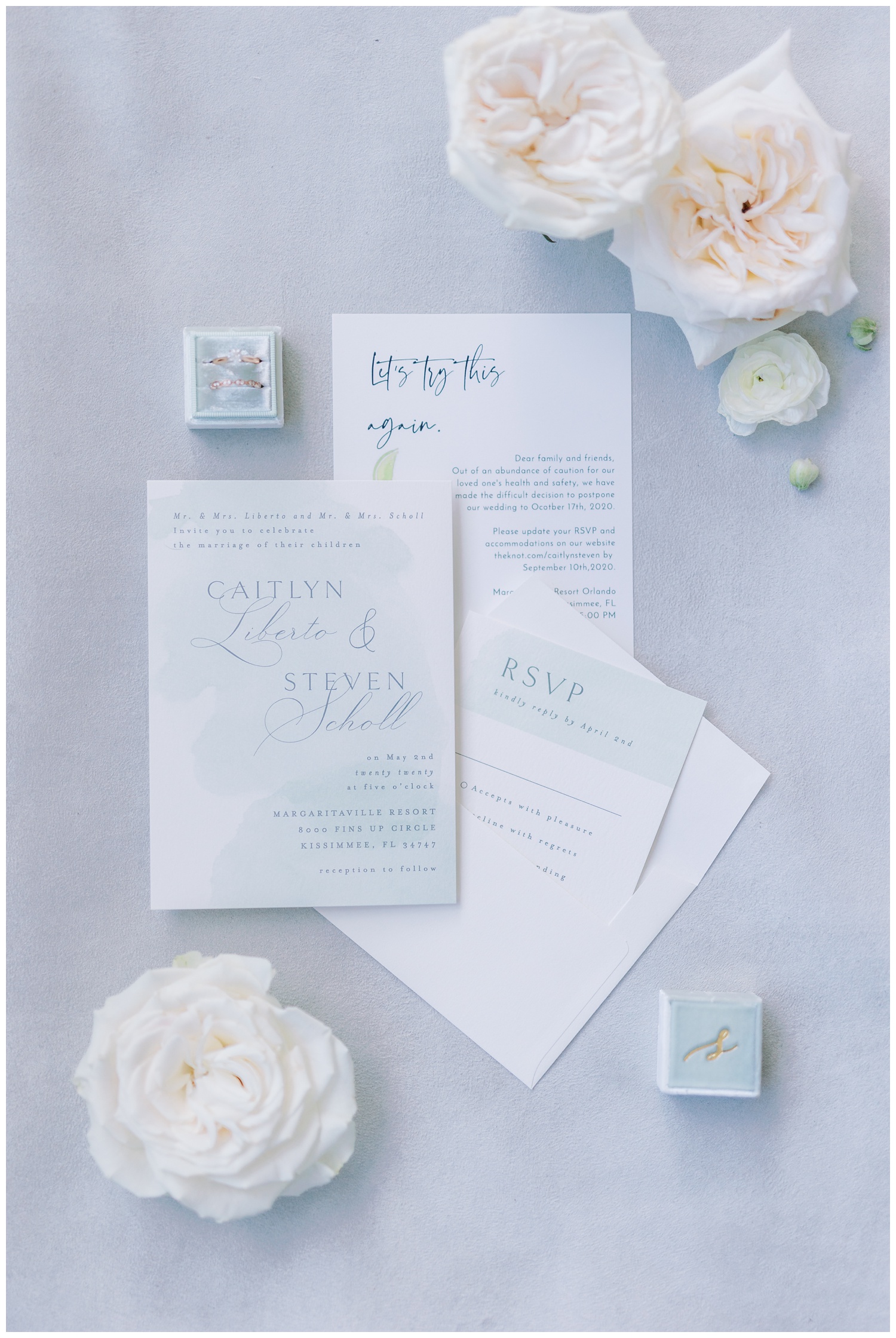 Wedding invitation flat lay with florals and Mrs Box