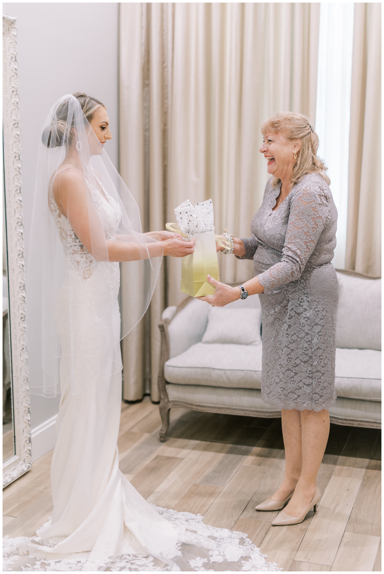 Bride giving mother gift on wedding day at Harborside Chapel