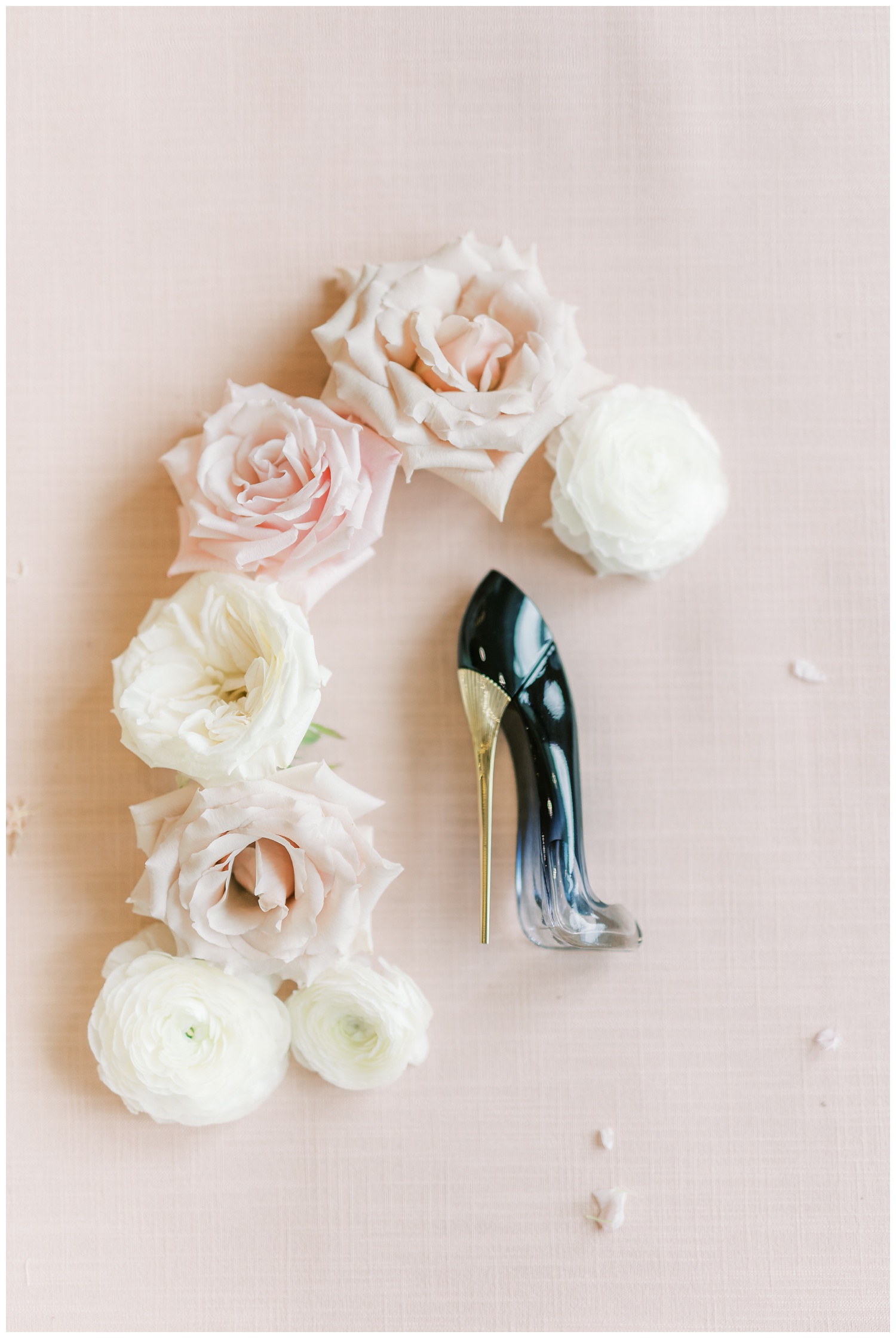 Carolina Herrera Good Girl perfume with wedding flowers