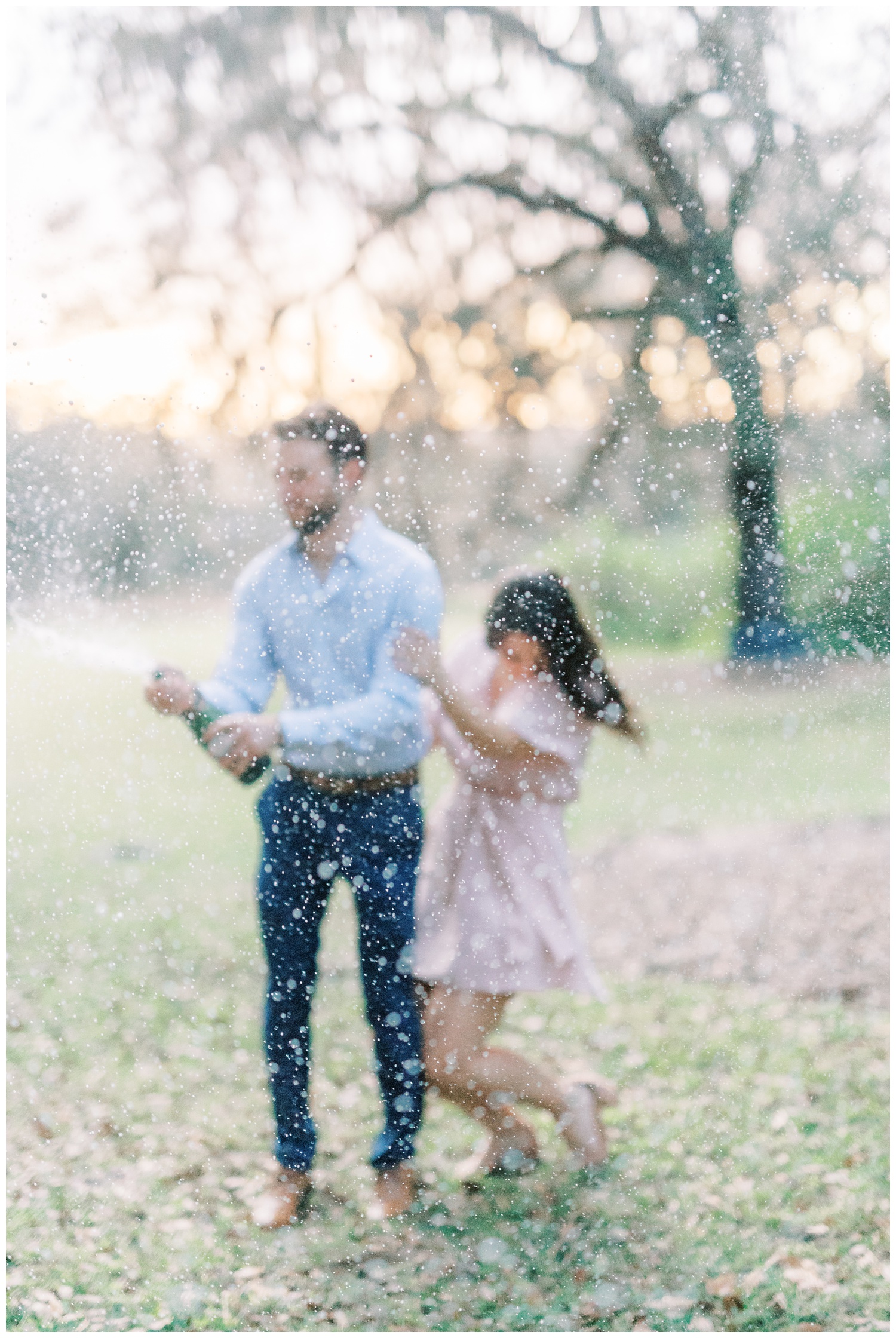 Engagement session with champagne pop